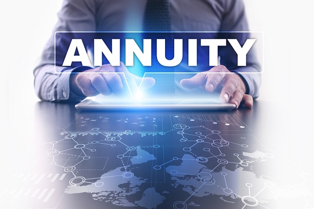 man typing the word Annuity