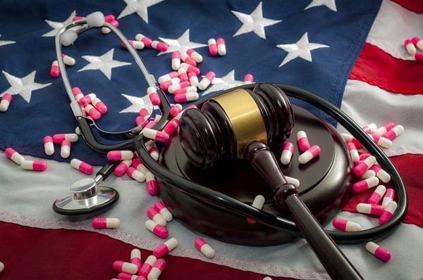Gavel on American flag with stethoscope