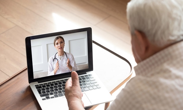 Man and doctor, telehealth appointment