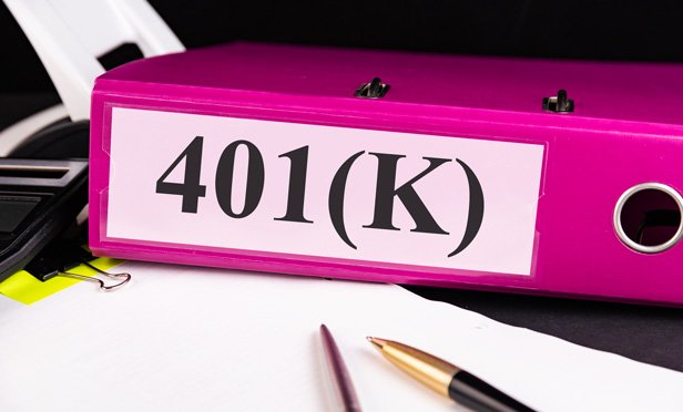 pink binder with 401k written on spine