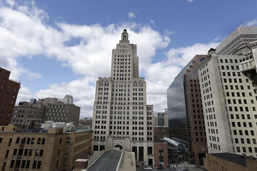 The Bank of America Building, center, stands in downtown Providence, R.I. The building is known to some as the “Superman building,” for its similarity to the Daily Planet headquarters in the old Superman TV show. (AP Photo/Steven Senne)