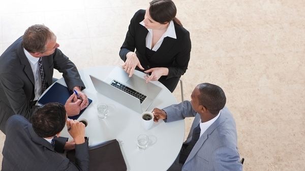 Employees at meeting table