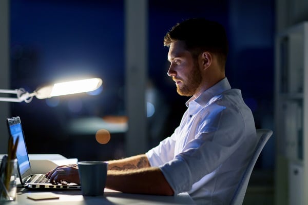 Young man working late