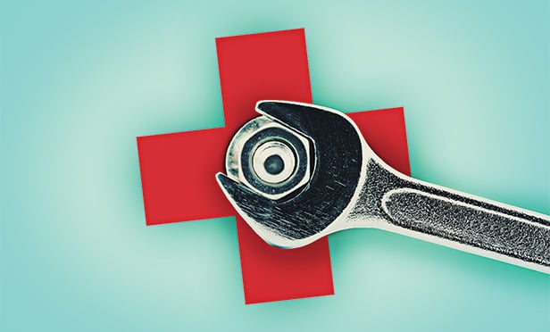 Health care symbol and wrench