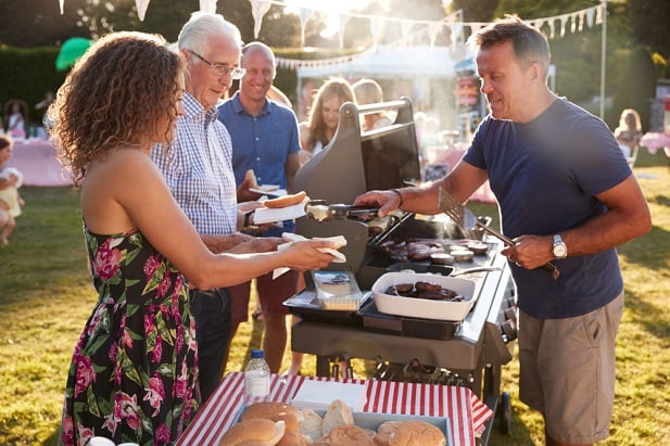 man barbequing at summer event