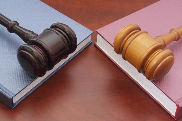 2 different colored gavels