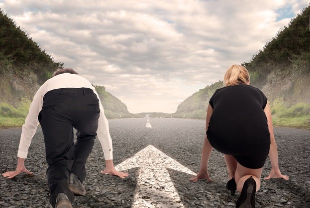 man and woman at starting line to race on road