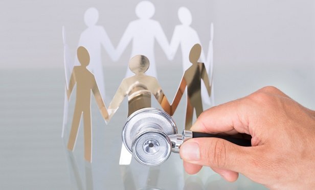 Stethoscope and cutout of people figures