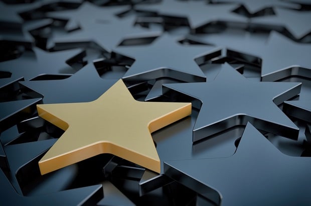gold star on a sea of metallic gray stars