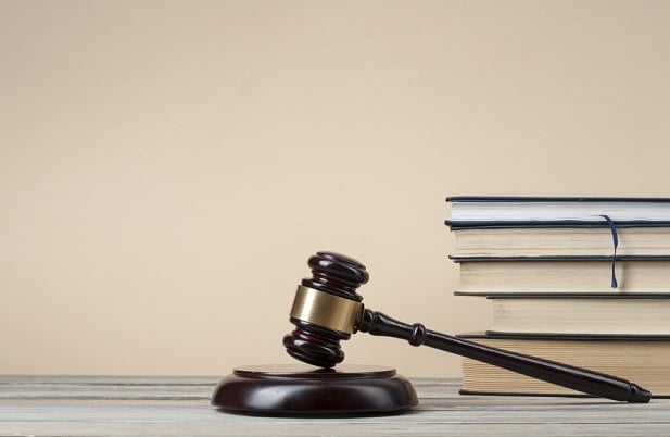 gavel with legal books in background