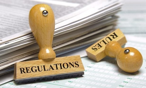 rubber stamp with word Regulations