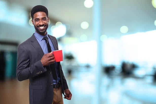 smiling business man with coffee mug