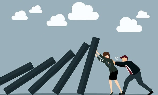 cartoon man and woman pushing falling dominos back up