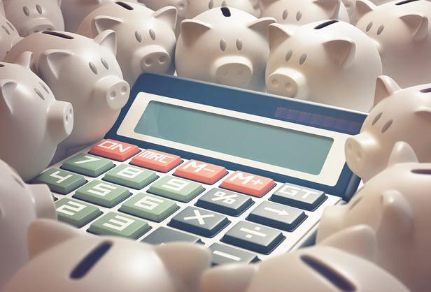 calculator surrounded by piggy banks