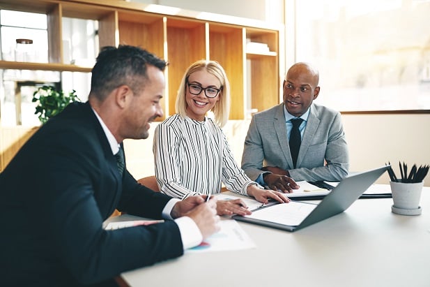 three smiling business people
