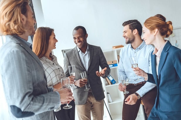 group of business people standing and talking