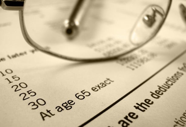 closeup of glasses on paper with numbers