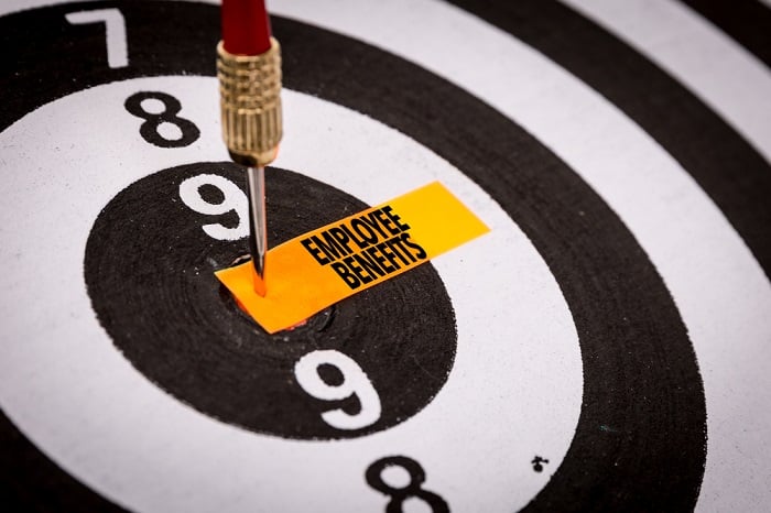 dart board with Employee Benefits pinned in center