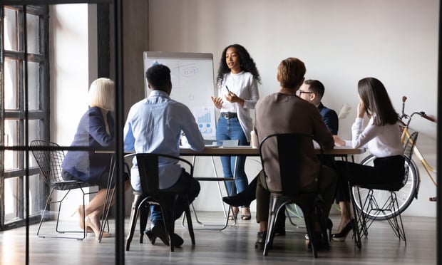 Group of workers sitting around a table