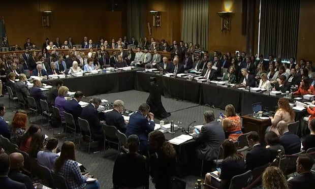 A large, packed Senate hearing room