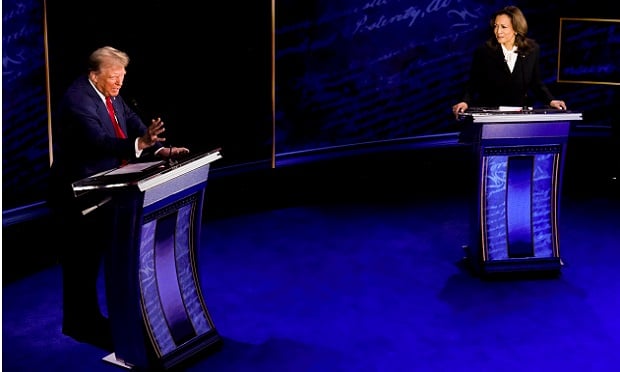 US Vice President Kamala Harris, right, and former US President Donald Trump during the second presidential debate at the Pennsylvania Convention Center in Philadelphia, Pennsylvania, US, on Tuesday, Sept. 10, 2024. Democrat Kamala Harris opened her presidential debate with Republican Donald Trump by touting her economic agenda, saying she was the only candidate on stage with a plan focused on "lifting up the middle class and working people of America." Photographer: Doug Mills/The New York Times/Bloomberg