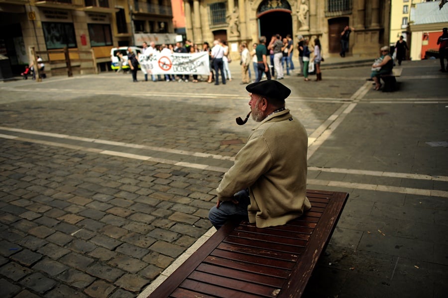 older man smoking pipe