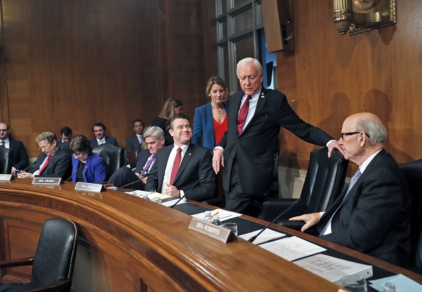 Senate Health, Education, Labor, and Pensions Committee member Sen. Orrin Hatch, R-Utah, center, takes his seat on Capitol Hill in Washington, Tuesday, Jan. 31, 2017, for the committee's executive session on the nomination of Education Secretary-designate Betsy DeVos. From left are, Sen. Rand Paul, R-Ky., Sen. Susan Collins, R-Maine, Sen. Bill Cassidy, R-La., Sen. Todd Young, R-Ind., Hatch and Sen. Pat Roberts, R-Kan. (AP Photo/Alex Brandon)