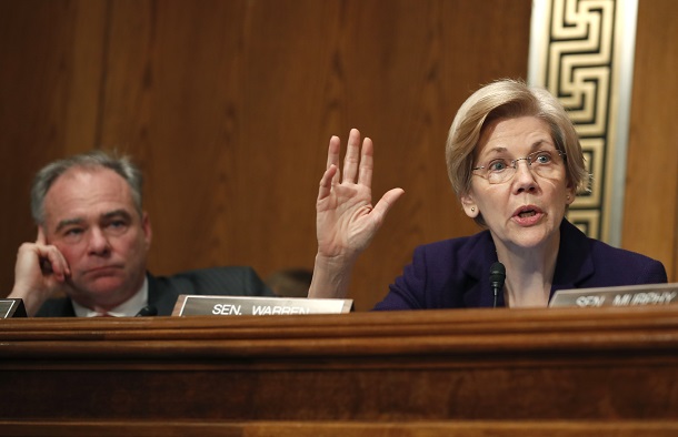 Sen. Elizabeth Warren, D-Mass., questions Education Secretary-designate Betsy DeVos on Capitol Hill in Washington, Tuesday, Jan. 17, 2017, at DeVos' confirmation hearing before the Senate Health, Education, Labor and Pensions Committee, as Sen. Tim Kaine, D-Va., listens. (AP Photo/Carolyn Kaster)