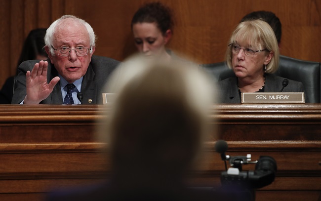 Sen. Patty Murray, D-Wash., the ranking member of the Senate Health, Education, Labor and Pensions Committee, right, looks to Sen. Bernie Sanders, I-Vt., left, as he questions Education Secretary-designate Betsy DeVos, center, on Capitol Hill in Washington, Tuesday, Jan. 17, 2017, at her confirmation hearing before the Senate Health, Education, Labor and Pensions Committee. (AP Photo/Carolyn Kaster)