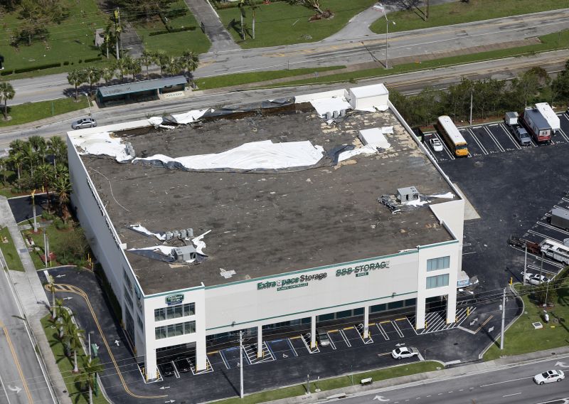 roof membrane of a storage building is peeled away in the wake of Hurricane Irma