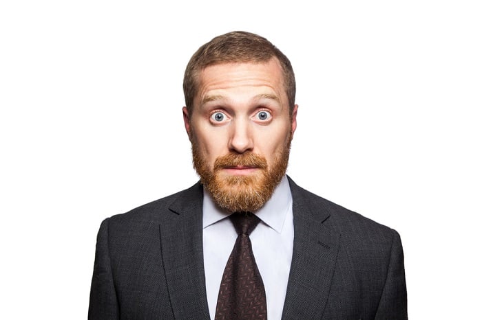 Bearded man looking shocked