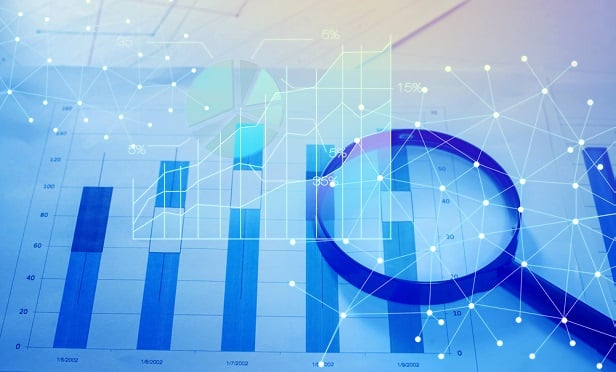 Data charts and magnifying glass