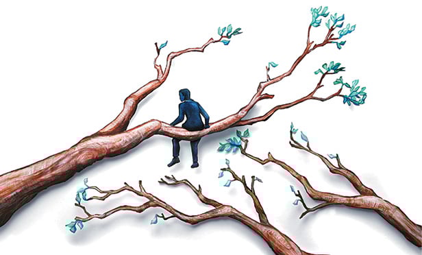 Businessman on a tree limb
