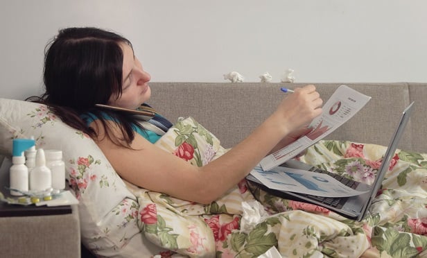 Sick woman working from home