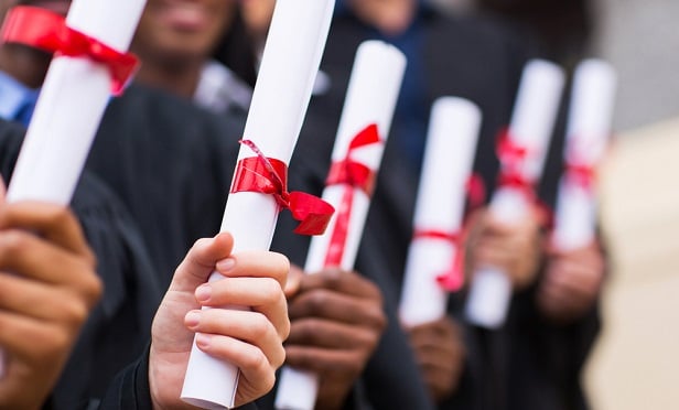 Graduates with diplomas
