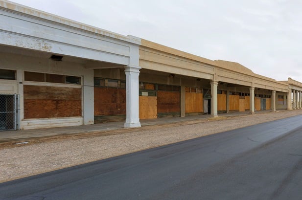 boarded up shopping mall