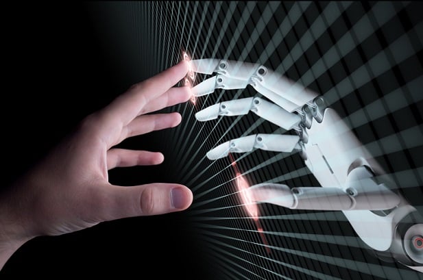 hand touching robot hand through computer screen