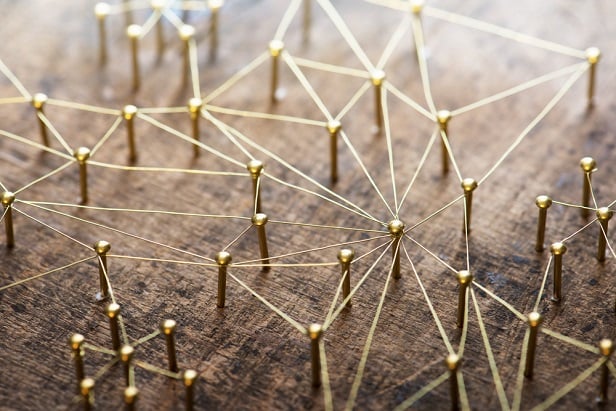 network of golden pins connected by wire