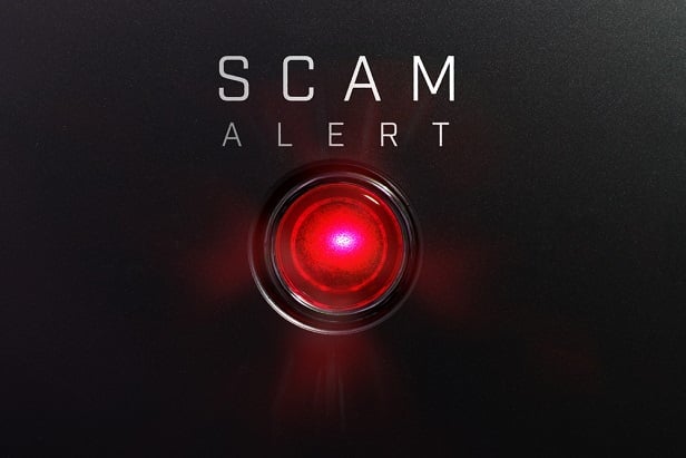 red button with word Scam Alert beside it
