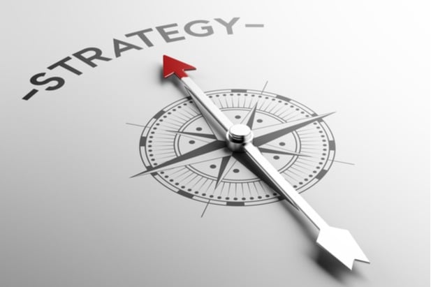 Compass arrow pointing at the word Strategy