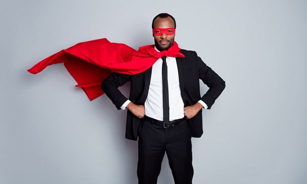 Businessman with red cape and mask