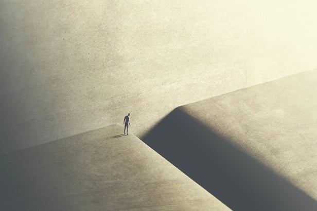 drawing of small figure standing at edge of big crevasse