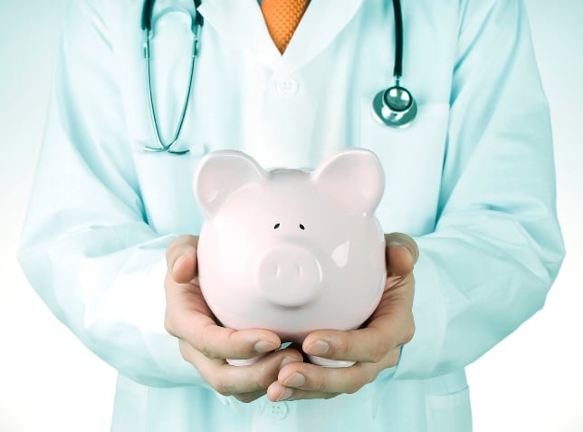 Doctor With Piggy Bank