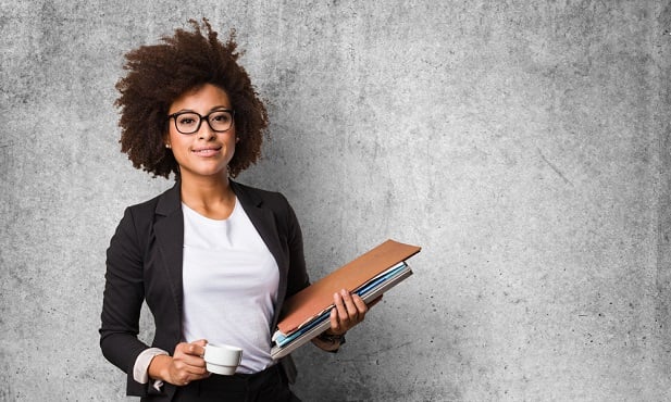 business woman holding folder and cup of coffee