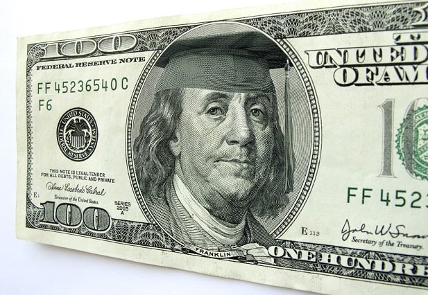 U.S. currency showing Ben Franklin with mortarboard and tassel