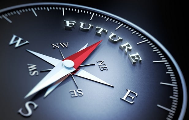 stylized gray compass with red needle pointing to word Future