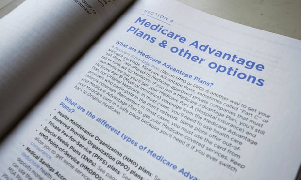 This Nov. 8, 2018 file photo shows a page from the 2019 U.S. Medicare Handbook in Washington. Health insurers will flood the Medicare Advantage market again this fall with enticing offers of plans that have no monthly price tag. The number of so-called zero-premium plans has been growing for years, and they can appeal to retirees who live on fixed incomes. Photo: Pablo Martinez Monsivais/AP