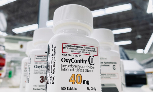 OxyContin bottle on counter.
