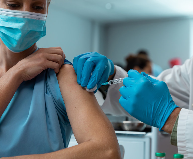 A woman gets a COVID-19 vaccine. Photo: wavebreak3/Adobe Stock