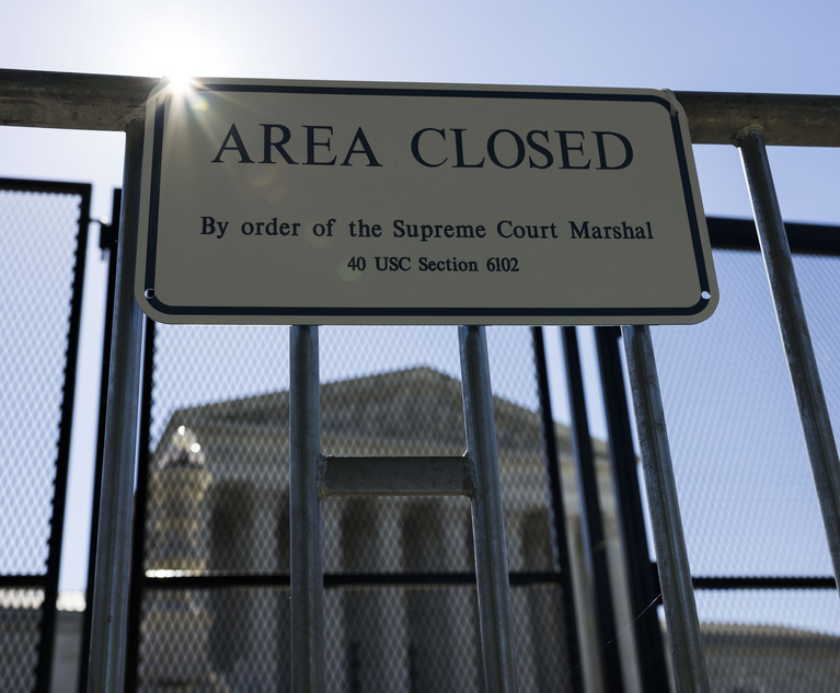 The U.S. Supreme Court building is surrounded by high metal fencing in the wake of a leaked draft opinion that suggests the Court would overturn Roe v. Wade, in Washington, D.C., on Wednesday, May 11, 2022. ( Photo: Diego M. Radzinschi/ALM)